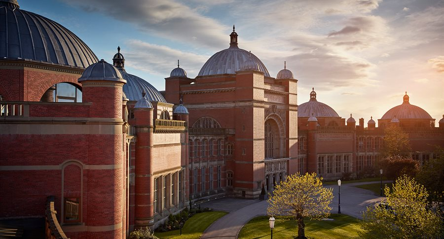 Image of Birmingham University against a sunset backdrop